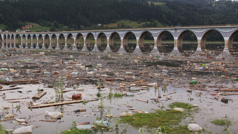 Polluted,Water,With,Plastic,Bottle,Debris,At,Bridge,Over,Bicaz