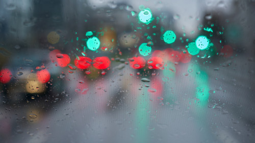 Traffic,In,Bad,Weather.,Windshield,With,Raindrops.,Green,Traffic,Light.