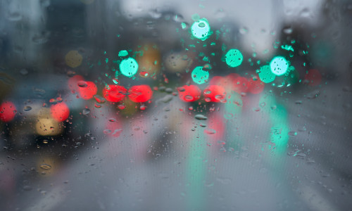 Traffic,In,Bad,Weather.,Windshield,With,Raindrops.,Green,Traffic,Light.