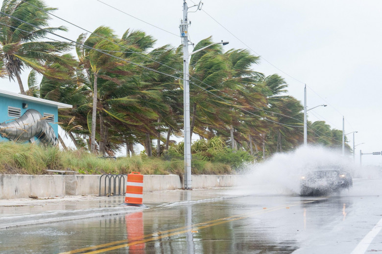 A Jeep drives through floodwaters near Smather's Beach ahead of Hurricane Milton. Hurricane Milton is forecast to make landfall along Florida's Gulf coast as a major hurricane is expected.