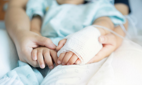 Closeup,A,Mother's,Hands,Holds,Her,Little,Son's,Hands,With