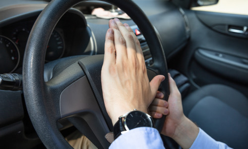 Angry,Driver,Pressing,Horn,And,Screaming,While,Driving