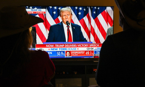 People watch President Donald Trump's victory speech