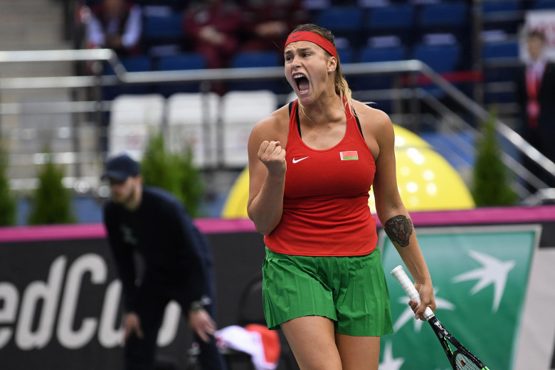 Minsk, Belarus. 21st April, 2018. Aryna Sabalenka (BLR) celebrates score in a FedCup match against Vikoria Kuzmova being played at Chizhovka Arena in Minsk, Belarus