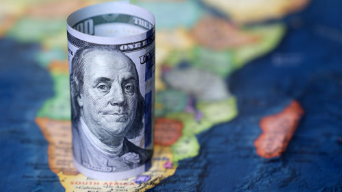 Us,Dollar,On,The,Africa,Map,Background.,American,Investment,And