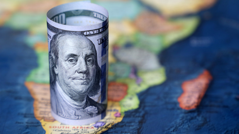 Us,Dollar,On,The,Africa,Map,Background.,American,Investment,And