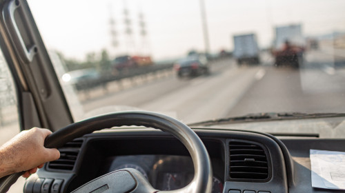 Male,Drives,Hands,Are,Holding,Steering,Wheel,Of,Truck,During