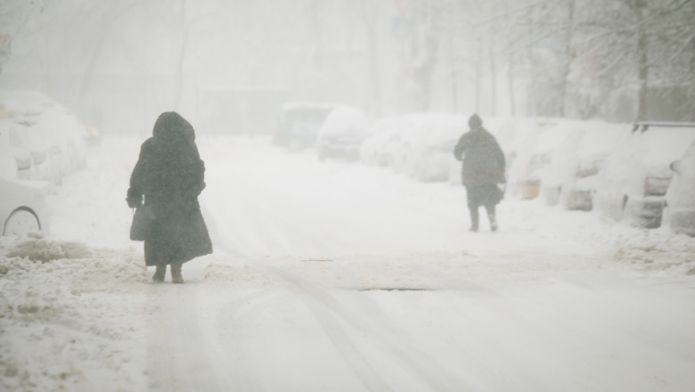 Woman,Struggles,To,Walk,Under,Heavy,Snowfall,Over,Bucharest,,Romania