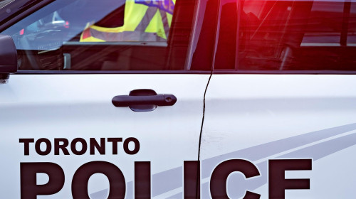 Toronto Canada / A Toronto Police Cruiser blocks Bloor Street West , in Yorkville Toronto.