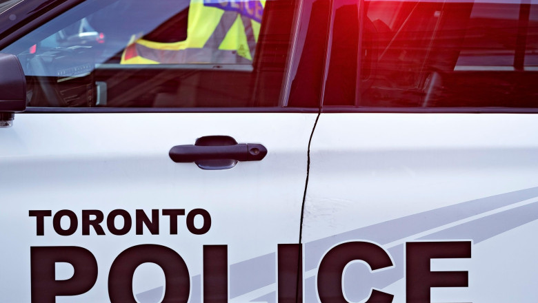 Toronto Canada / A Toronto Police Cruiser blocks Bloor Street West , in Yorkville Toronto.