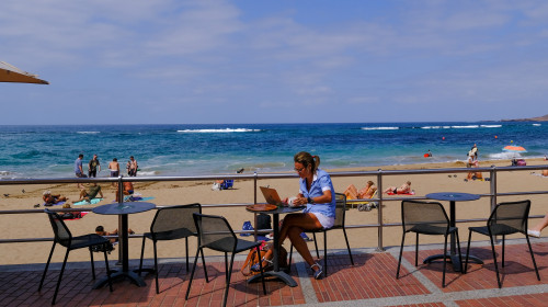 A,Man,Working,Using,Mobile,Phone,And,Laptop,Computer,In