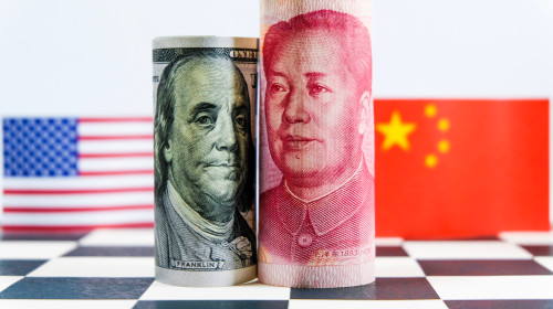 America,Dollar,And,Yuan,Banknote,With,Usa,And,China,Flags.
