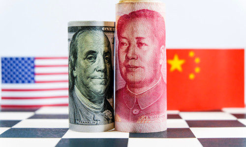 America,Dollar,And,Yuan,Banknote,With,Usa,And,China,Flags.