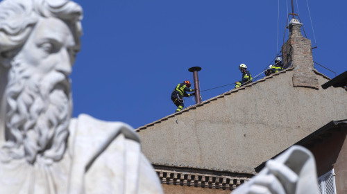 Vatican, Rome: Vatican'S Firefighters Setup The Chimney On The Roof Of The Sistine Chapel Past The Statue Of St Paul Ahead Of The Cardinals Conclave