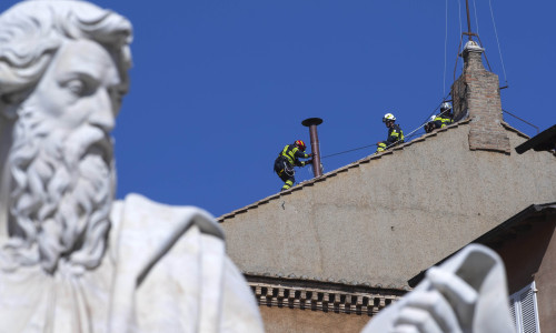 Vatican, Rome: Vatican'S Firefighters Setup The Chimney On The Roof Of The Sistine Chapel Past The Statue Of St Paul Ahead Of The Cardinals Conclave