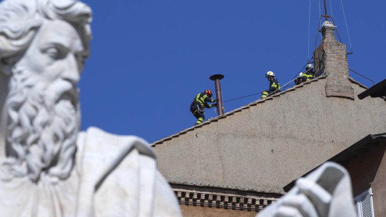 Vatican, Rome: Vatican'S Firefighters Setup The Chimney On The Roof Of The Sistine Chapel Past The Statue Of St Paul Ahead Of The Cardinals Conclave