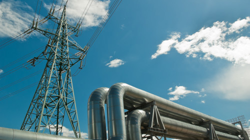 Pipeline,And,Power,Line,Support,,In,The,Photo,Pipeline,And