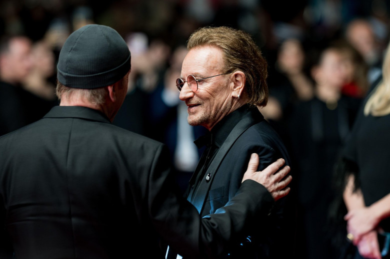 CANNES, FRANCE - MAY 16: The Edge, Amal Clooney and Bono attend the "Bono: Stories Of Surrender" red carpet at the 78th annual Cannes Film Festival at