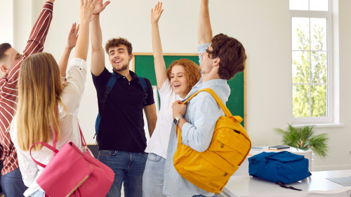Intelligent,High,School,Students,Rise,Hands,Up,At,Modern,Classroom