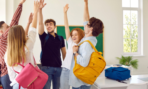 Intelligent,High,School,Students,Rise,Hands,Up,At,Modern,Classroom