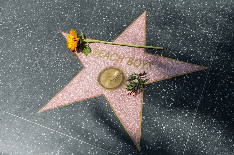Flowers are laid at The Beach Boys’ Walk of Fame star after Brian Wilson’s passing