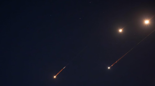 JERUSALEM - JUNE 14: Debris of missiles fired from Iran towards the territory of Israel leave trails in the night sky after being intercepted on June 14, 2025 in Jerusalem. Iran launched a retaliatory missile strike on Israel starting late on June 13, af