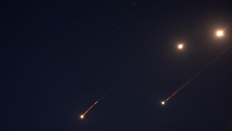 JERUSALEM - JUNE 14: Debris of missiles fired from Iran towards the territory of Israel leave trails in the night sky after being intercepted on June 14, 2025 in Jerusalem. Iran launched a retaliatory missile strike on Israel starting late on June 13, af