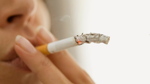 Close up of woman smoking cigarette