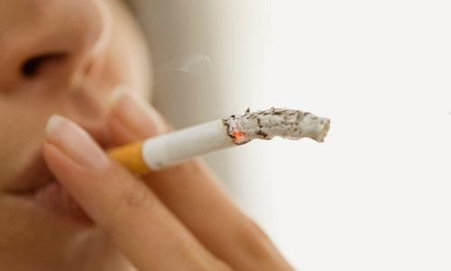Close up of woman smoking cigarette