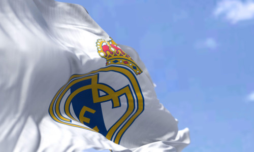 Madrid, Spain, May 2022: The flag of Real Madrid Club de Fútbol waving in the wind on a clear day. Real Madrid C.F. is a Spanish professional football