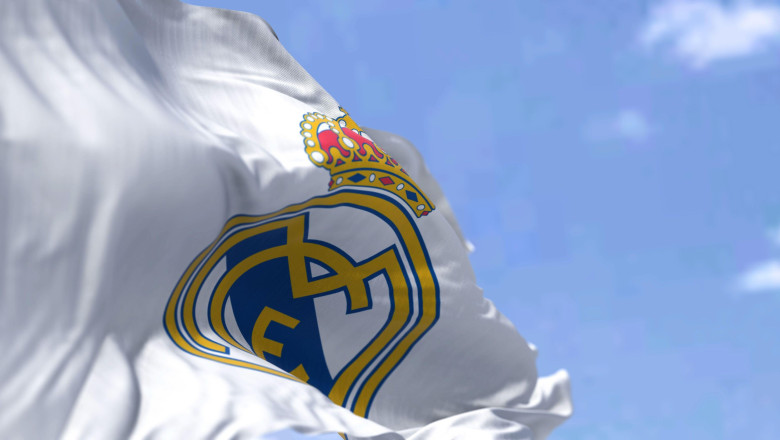 Madrid, Spain, May 2022: The flag of Real Madrid Club de Fútbol waving in the wind on a clear day. Real Madrid C.F. is a Spanish professional football