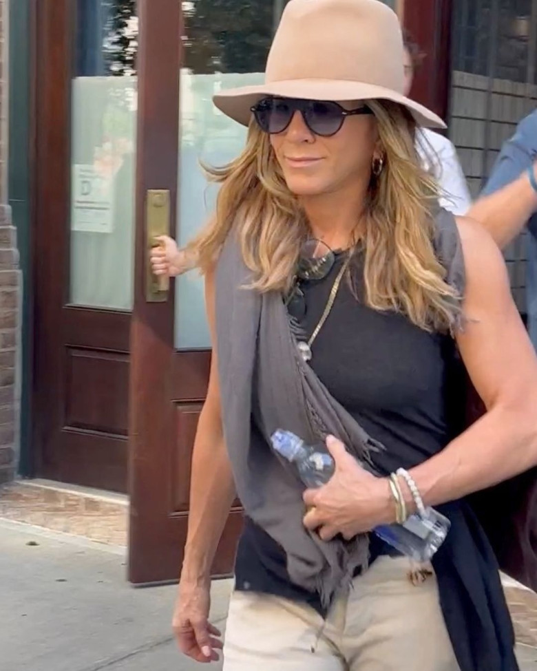 Jennifer Aniston and Jim Curtis check out of the Greenwich Hotel in New York