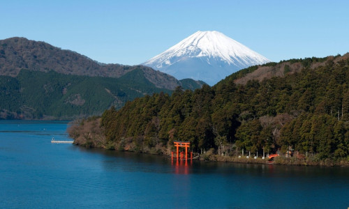 A tourist sightseeing pirate ship sails the waters of Ashinoko (Lake Ashi) near Mount Fuji in the mountain resort town of Hakone, Kanagawa, Japan.