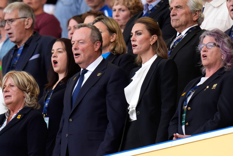The Princess of Wales with Jonathan Webb, Vice-Chair of the Executive Board of World Rugby (left) in the stands sing the national anthem before the Women's Rugby World Cup 2025 pool A match at the Brighton and Hove Albion Stadium, Brighton. Picture date: