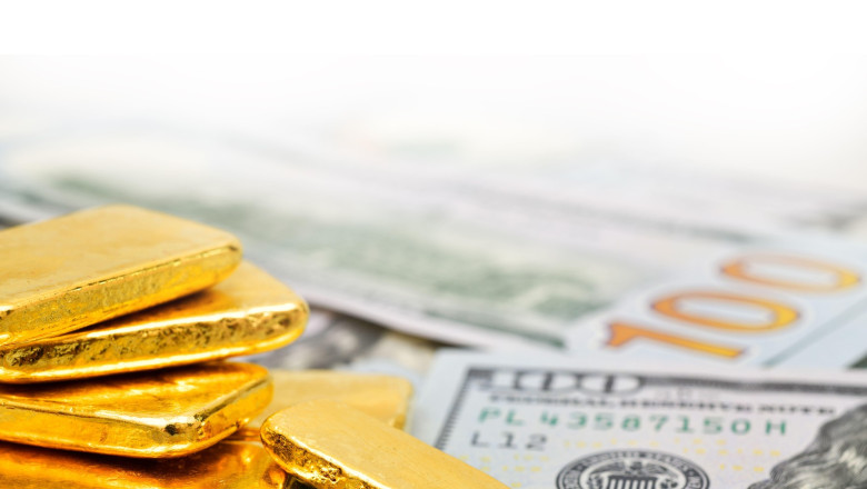 Paper us 100 dollar bill with gold bars, concept of investment and saving, wealth