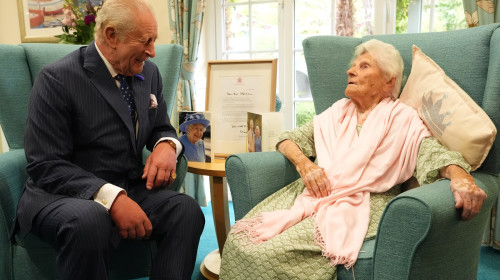 King Charles III meets world's oldest person