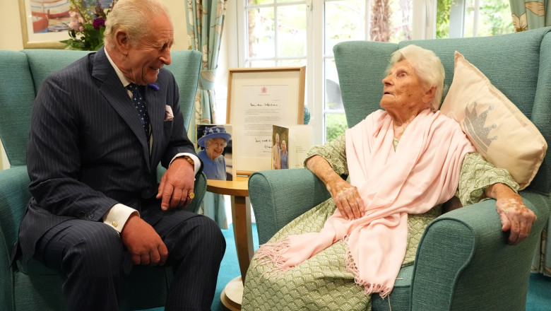 King Charles III meets world's oldest person