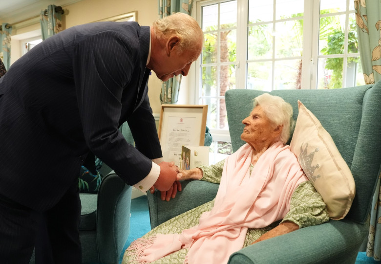 King Charles III meets world's oldest person