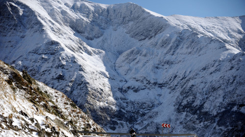Motorcyclist riding high up on Transfagarasan road