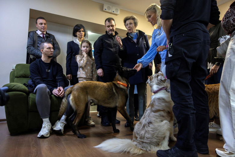 The Princess Royal (centre right) visits the dog therapy department of a rehabilitation centre for Ukrainian war veterans in Kyiv, after making a surprise trip to Ukraine in a show of solidarity with children and families facing the horrors of the Russian