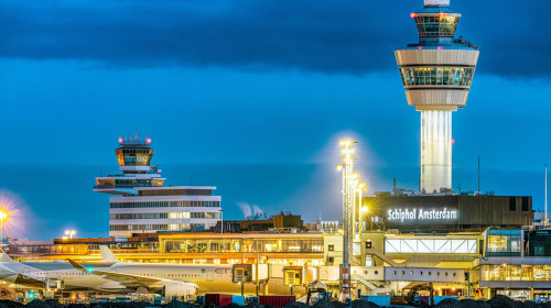 Schiphol Airport Air Traffic Control Tower of Schiphol Amsterdam International Airport at night. Airport towers at Amsterdam Schiphol Airport.