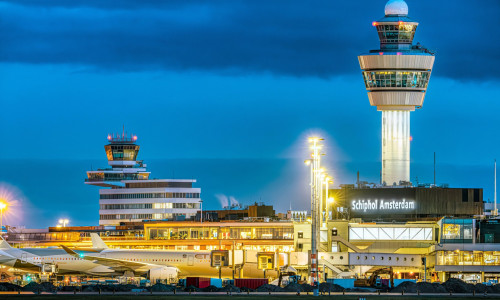 Schiphol Airport Air Traffic Control Tower of Schiphol Amsterdam International Airport at night. Airport towers at Amsterdam Schiphol Airport.