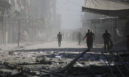 Palestinians inspect the destruction after Israeli airstrike hit Bank of Palestine in Gaza Strip, Gaza city, Gaza Strip, Palestinian Territory - 24 Sep 2025