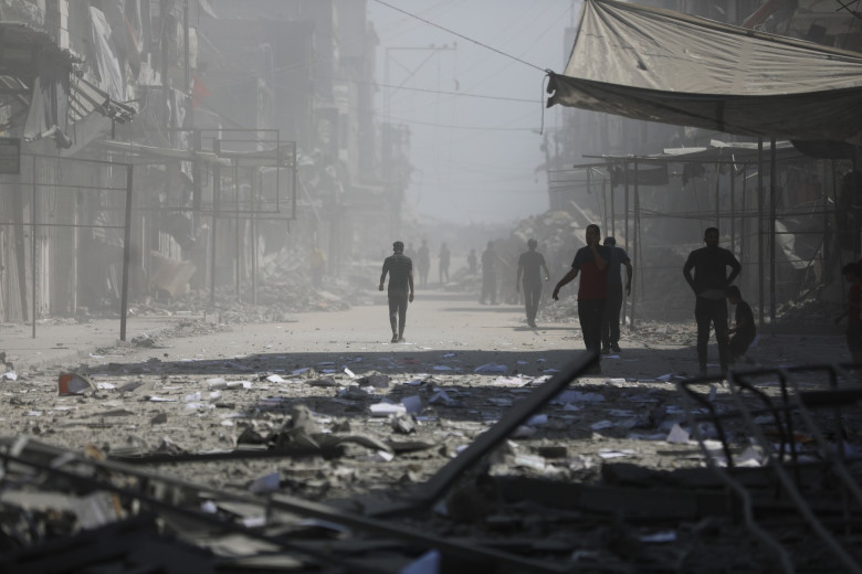 Palestinians inspect the destruction after Israeli airstrike hit Bank of Palestine in Gaza Strip, Gaza city, Gaza Strip, Palestinian Territory - 24 Sep 2025