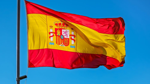 Spain flag on blue sky