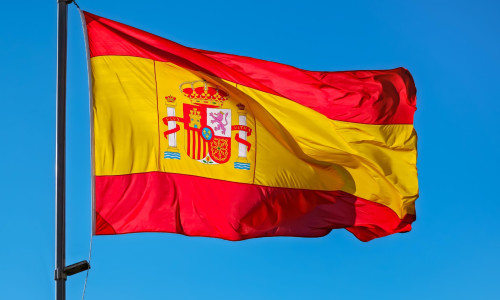 Spain flag on blue sky