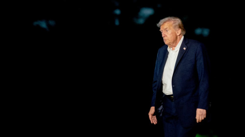 US President Donald Trump walks on the South Lawn of the White House