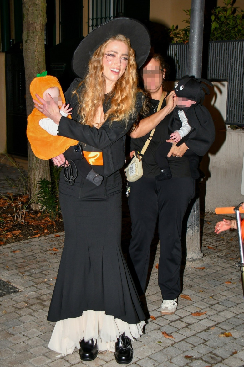 Amber Heard steps out with her three daughters for Halloween night of fun
