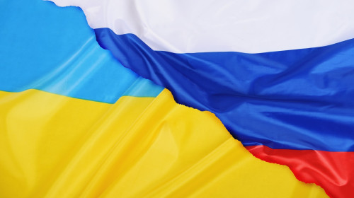 Background of Ukraine country flag versus Russia flag