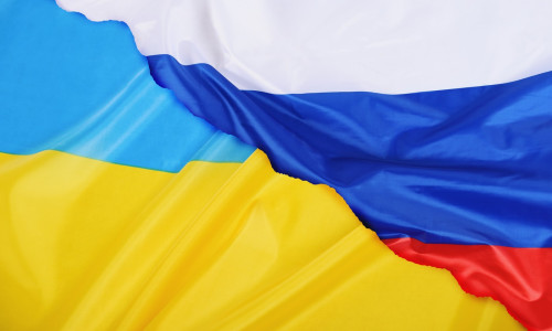 Background of Ukraine country flag versus Russia flag